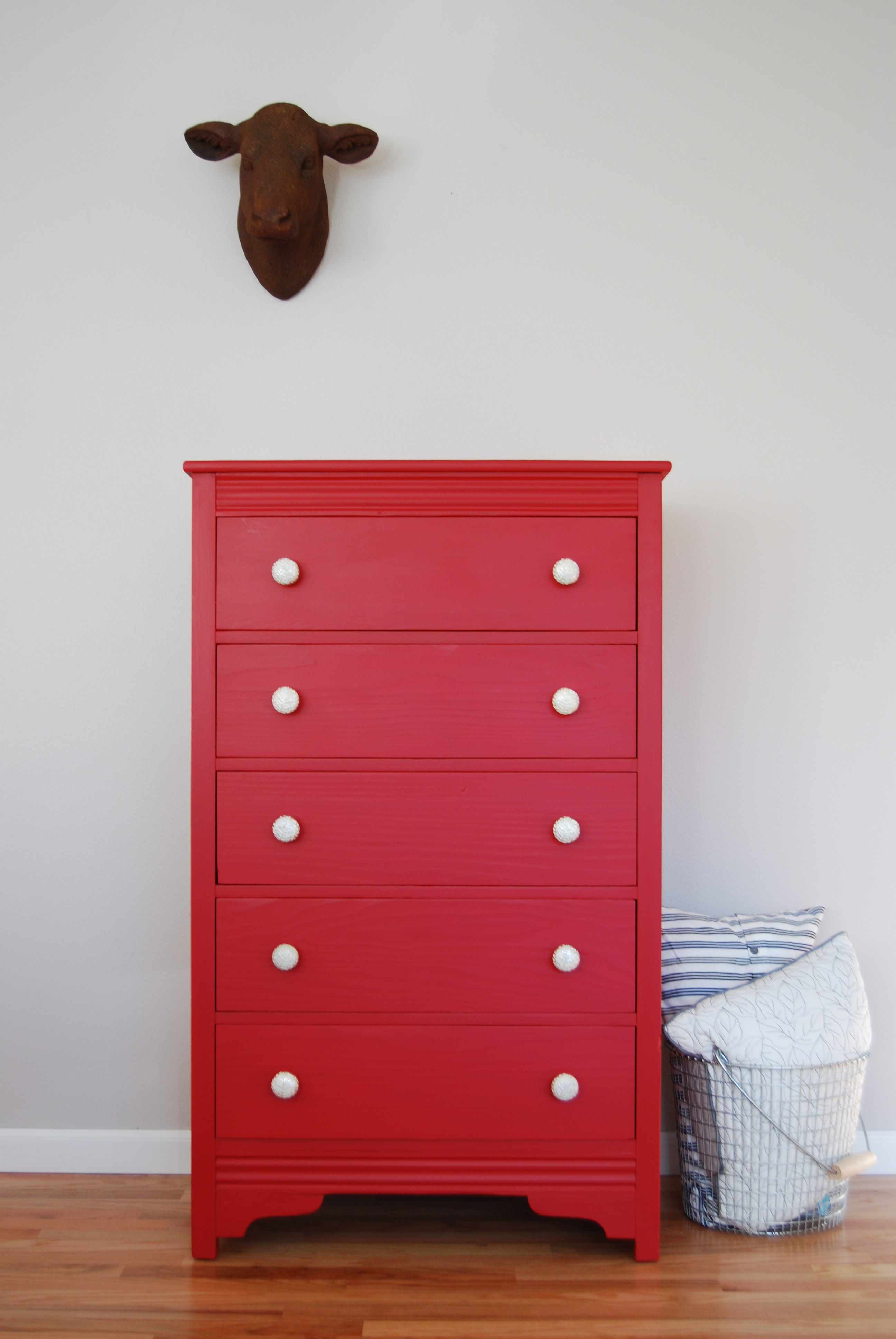 A Tall Red Dresser With Silver And White Knobs The Weathered Door