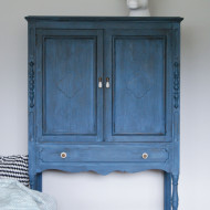 A deep blue milk paint cabinet