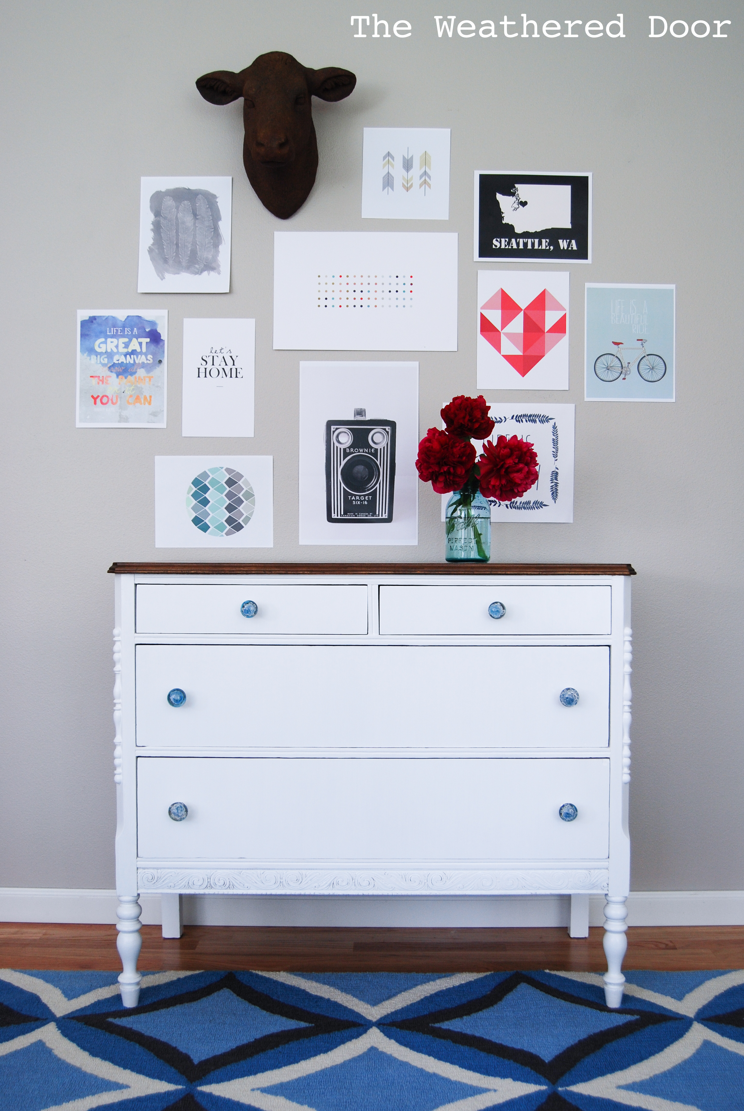 White And Wood Farmhouse Dresser With Blue Glass Knobs The